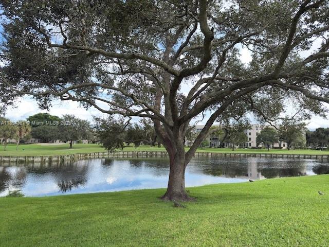 9441 Live Oak Place, Unit 207 Davie, FL 33324 - Photo 16 of 24 a view of a lake with a large trees