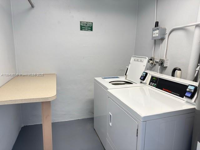 9441 Live Oak Place, Unit 207 Davie, FL 33324 - Photo 19 of 24 a utility room with dryer and washer