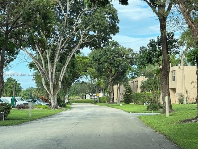 9441 Live Oak Place, Unit 207 Davie, FL 33324 - Photo 20 of 24 a view of a house with a big yard and large trees