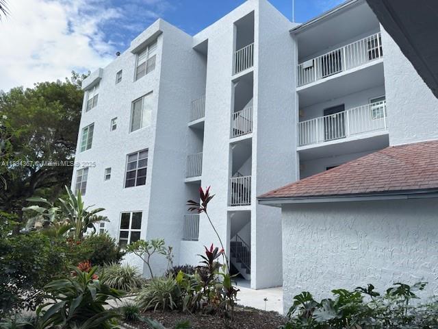 9441 Live Oak Place, Unit 207 Davie, FL 33324 - Photo 2 of 24 a view of outdoor space yard and front view of a house