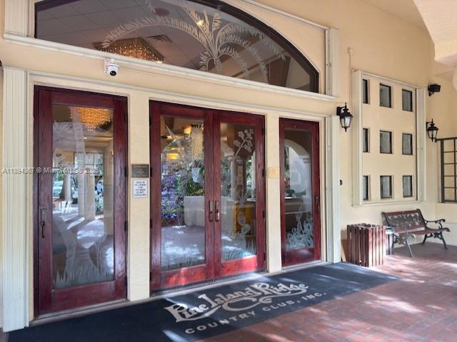 9441 Live Oak Place, Unit 207 Davie, FL 33324 - Photo 22 of 24 a view of a entryway door front of house