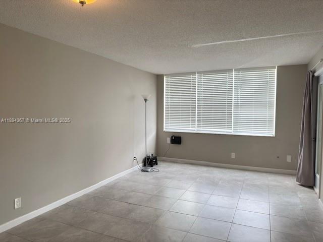 9441 Live Oak Place, Unit 207 Davie, FL 33324 - Photo 5 of 24 a view of an empty room with a window