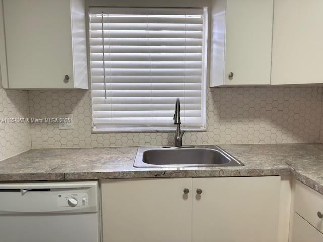 9441 Live Oak Place, Unit 207 Davie, FL 33324 - Photo 8 of 24 a kitchen with granite countertop a sink and a granite counter tops