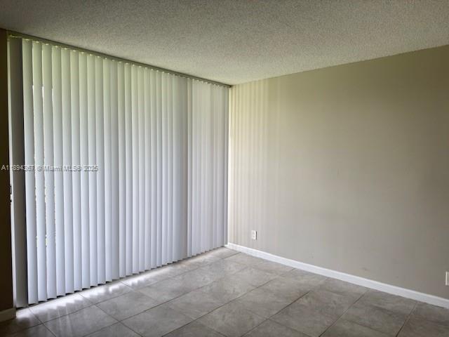 9441 Live Oak Place, Unit 207 Davie, FL 33324 - Photo 9 of 24 an empty room with wooden floor