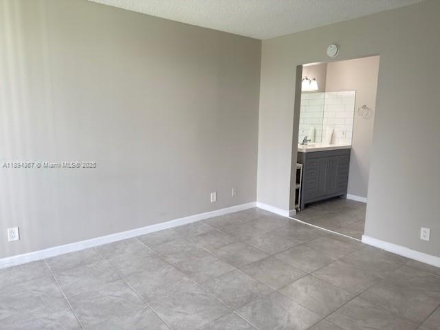 9441 Live Oak Place, Unit 207 Davie, FL 33324 - Photo 10 of 24 an empty room with cabinet and mirror