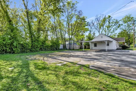 a backyard of a house with lots of green space