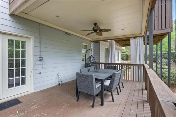 a view of a patio with a table and chairs