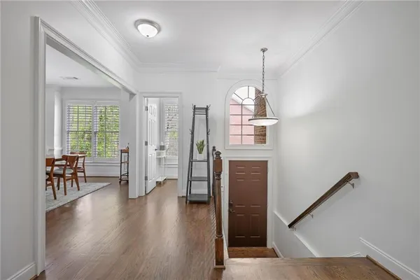 a view of a livingroom with furniture hardwood floor and staircase