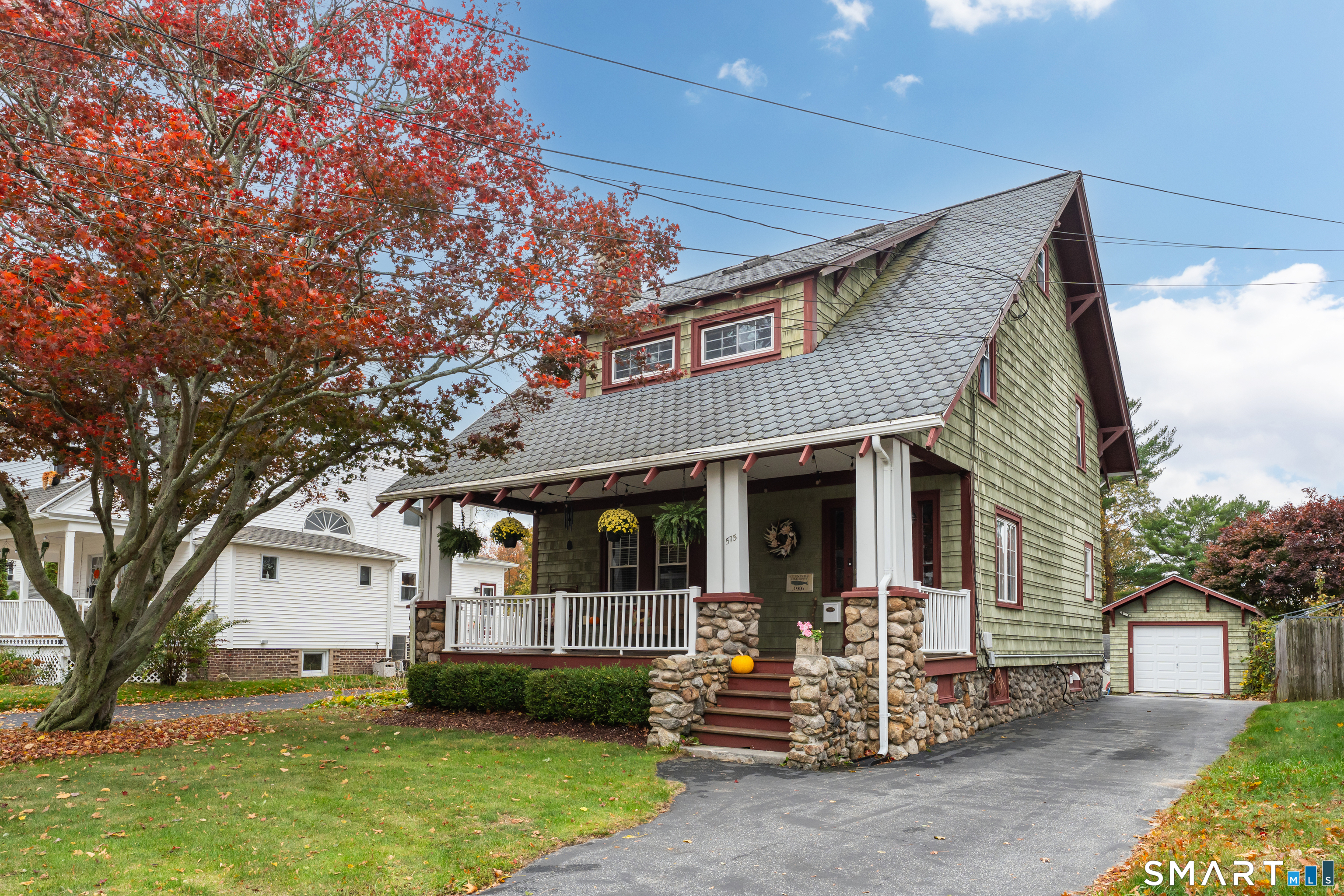 575 Ocean Avenue New London, CT 06320 - Photo 2 of 40 a front view of a house with a garden and trees