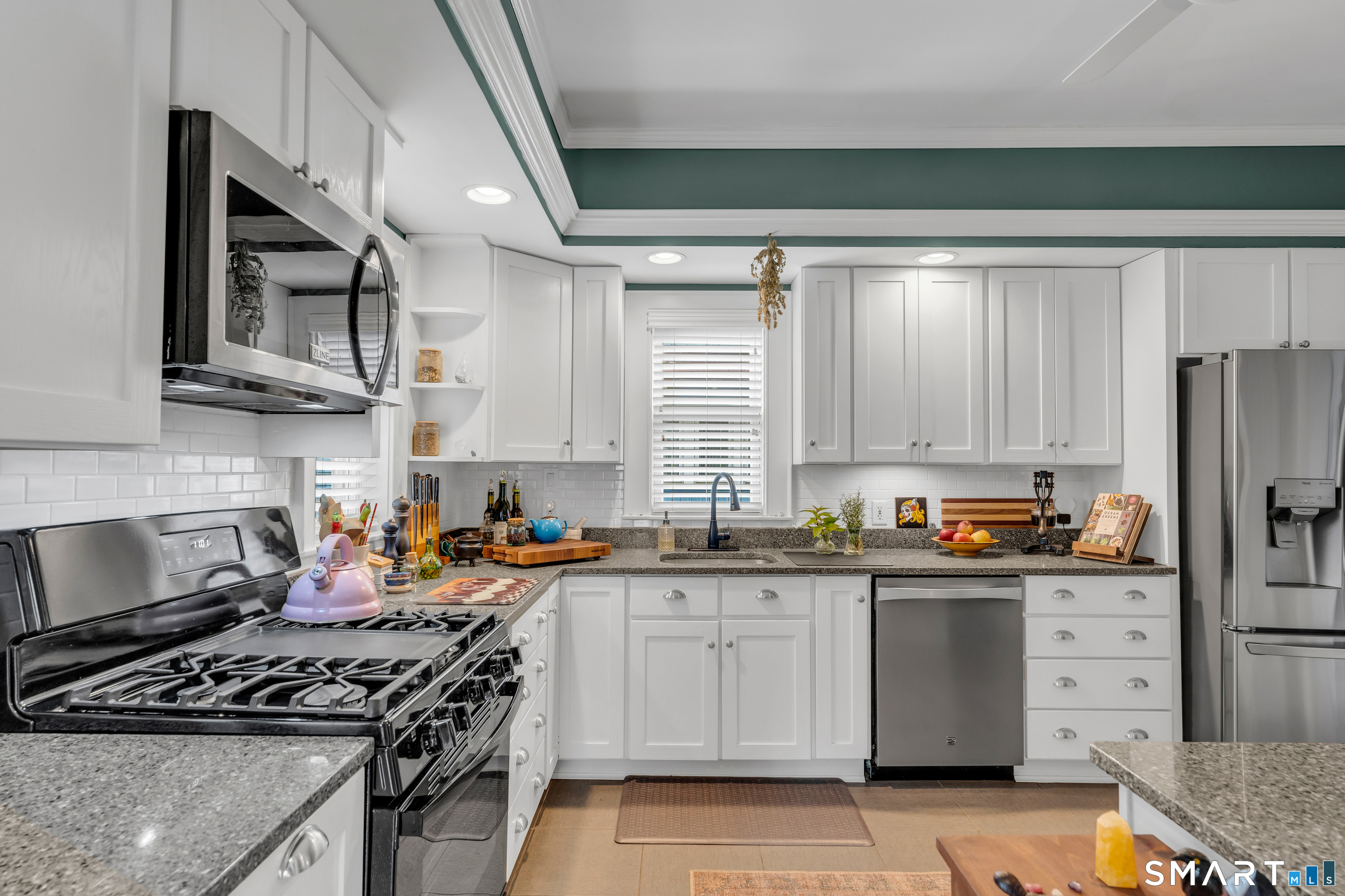 575 Ocean Avenue New London, CT 06320 - Photo 21 of 40 a kitchen with stainless steel appliances granite countertop a stove a sink dishwasher and a refrigerator