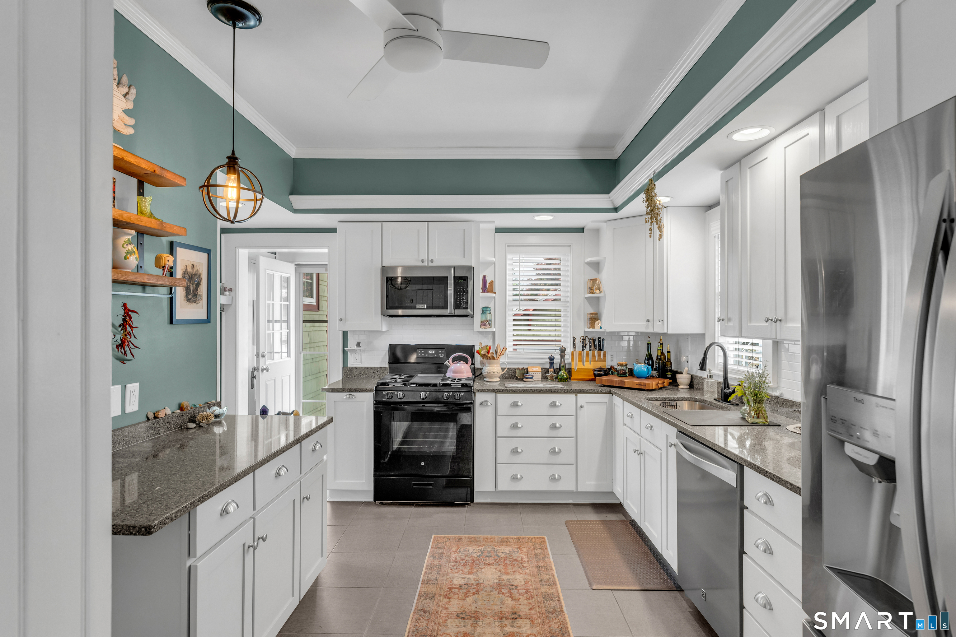 575 Ocean Avenue New London, CT 06320 - Photo 23 of 40 a kitchen with stainless steel appliances granite countertop a refrigerator and a stove