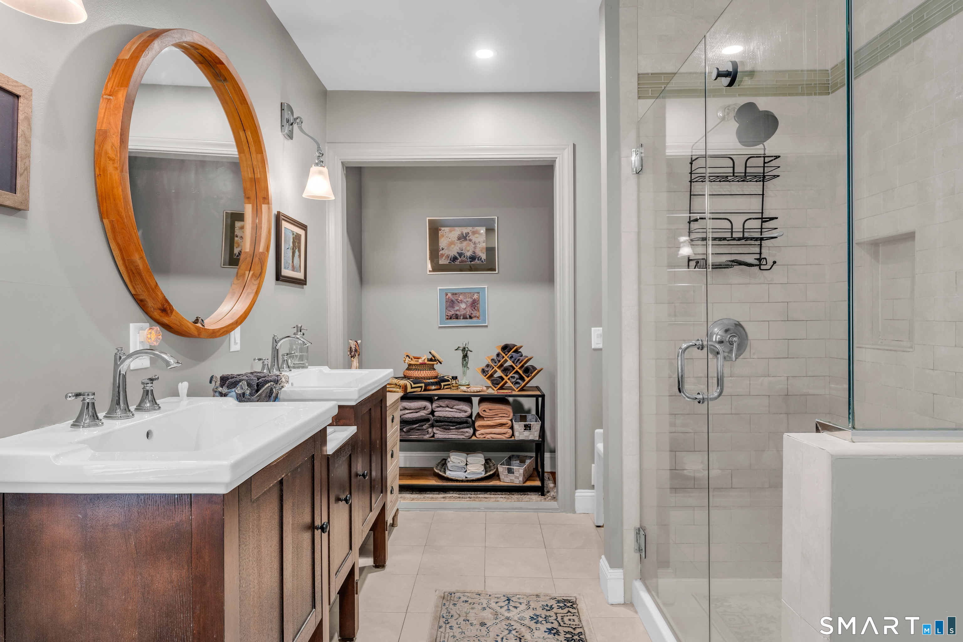 575 Ocean Avenue New London, CT 06320 - Photo 31 of 40 a en suite bathroom with a double vanity sink and a mirror