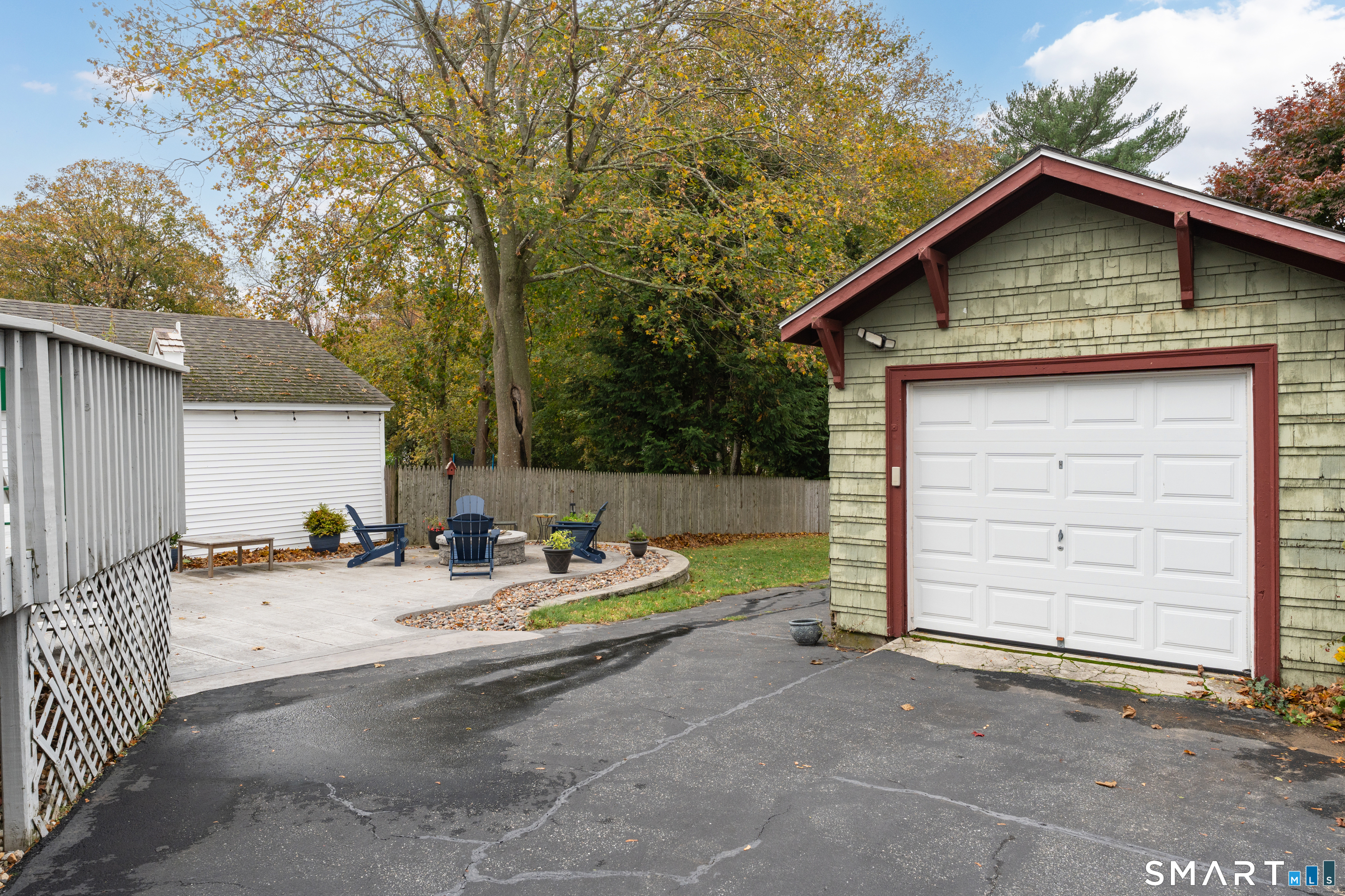 575 Ocean Avenue New London, CT 06320 - Photo 4 of 40 a view of backyard of house with wooden fence and trees