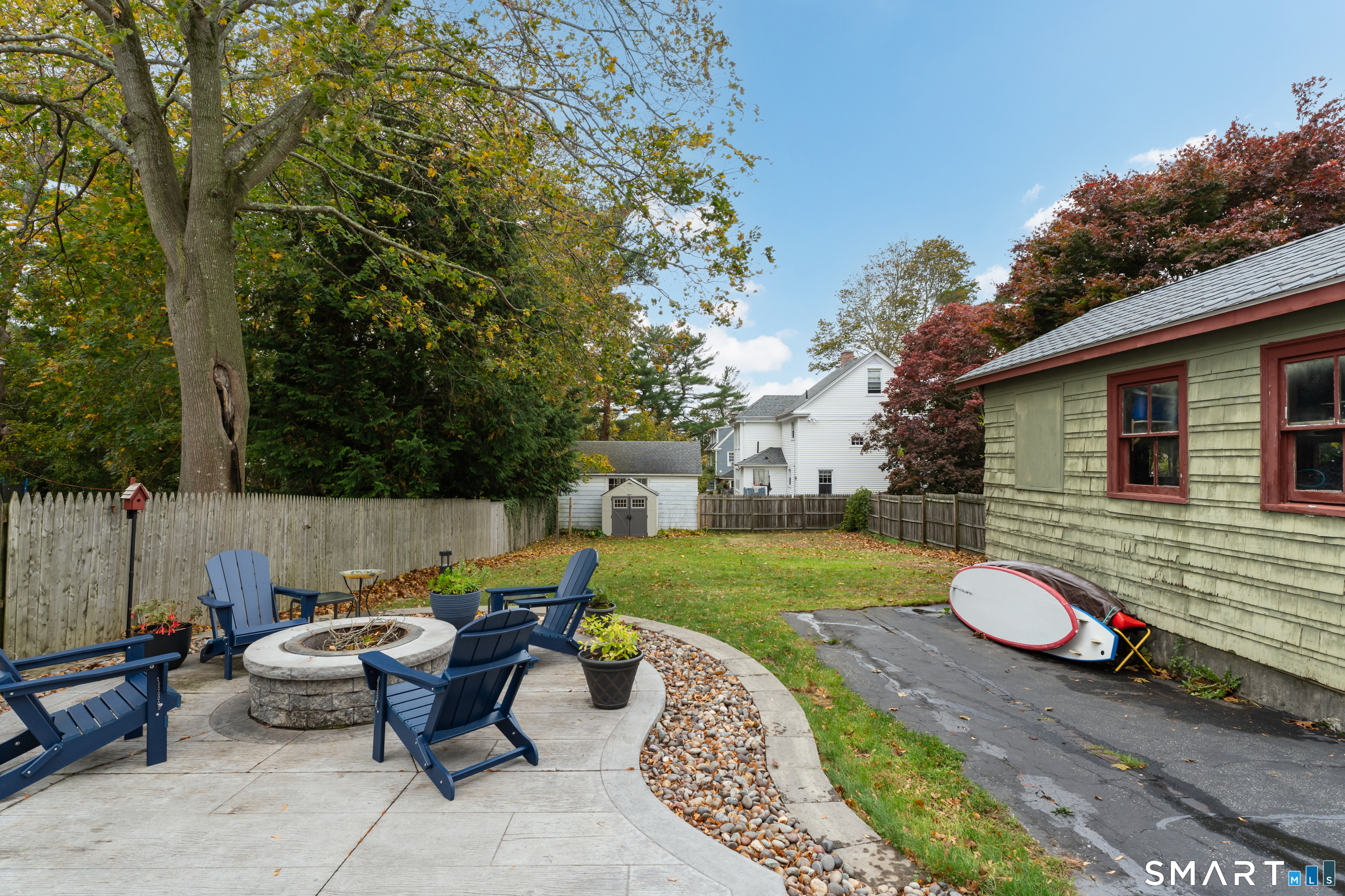 575 Ocean Avenue New London, CT 06320 - Photo 5 of 40 a backyard of a house with table and chairs