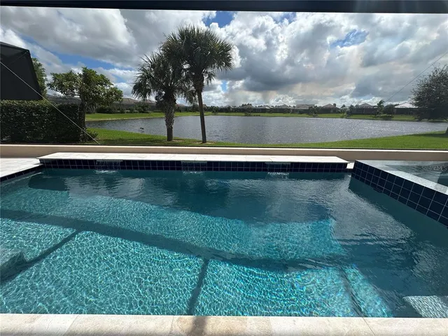 a view of swimming pool with a yard
