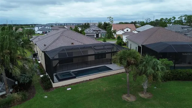 a aerial view of a house with a yard
