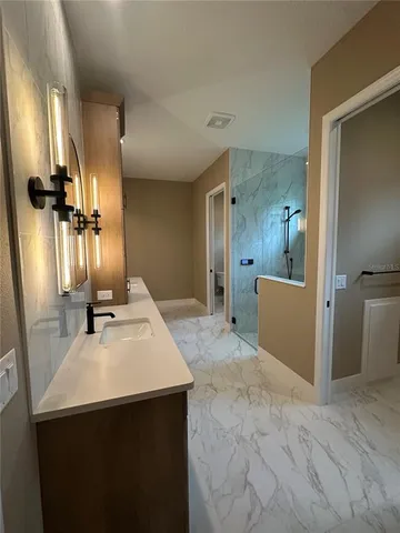 a view of a kitchen with a sink