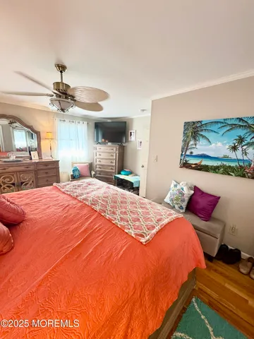 a bed room with a bed and a chandelier