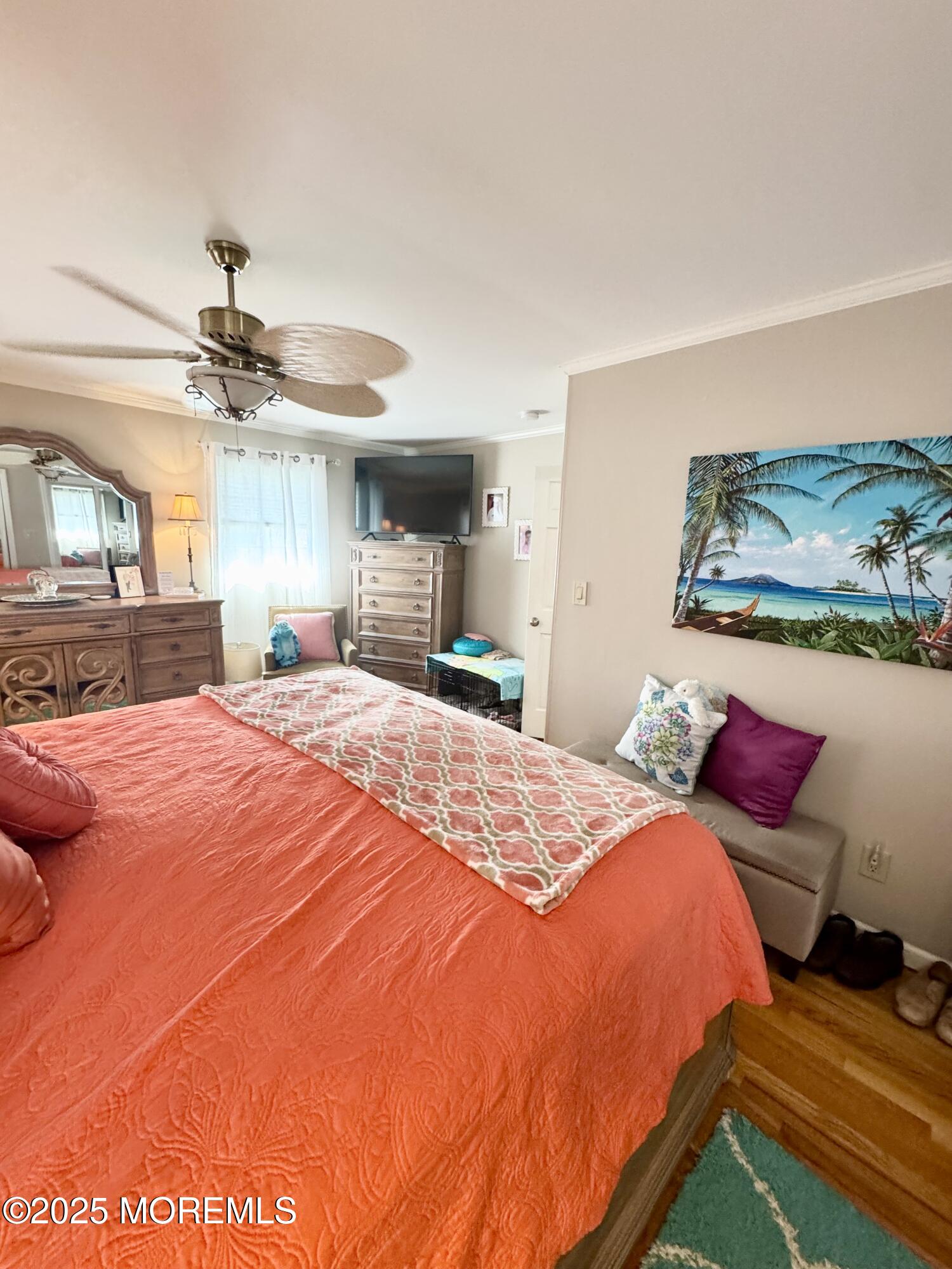 902 10th Street Union Beach, NJ 07735 - Photo 12 of 37 a bed room with a bed and a chandelier