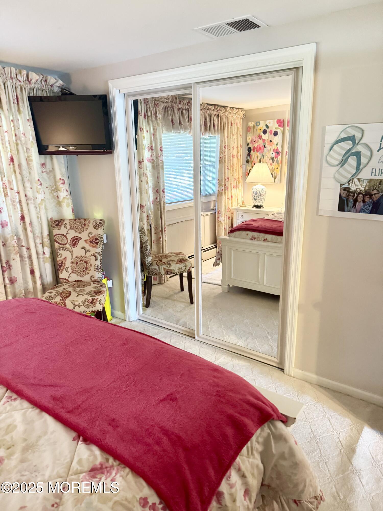 902 10th Street Union Beach, NJ 07735 - Photo 16 of 37 a bedroom with a bed and flat screen tv