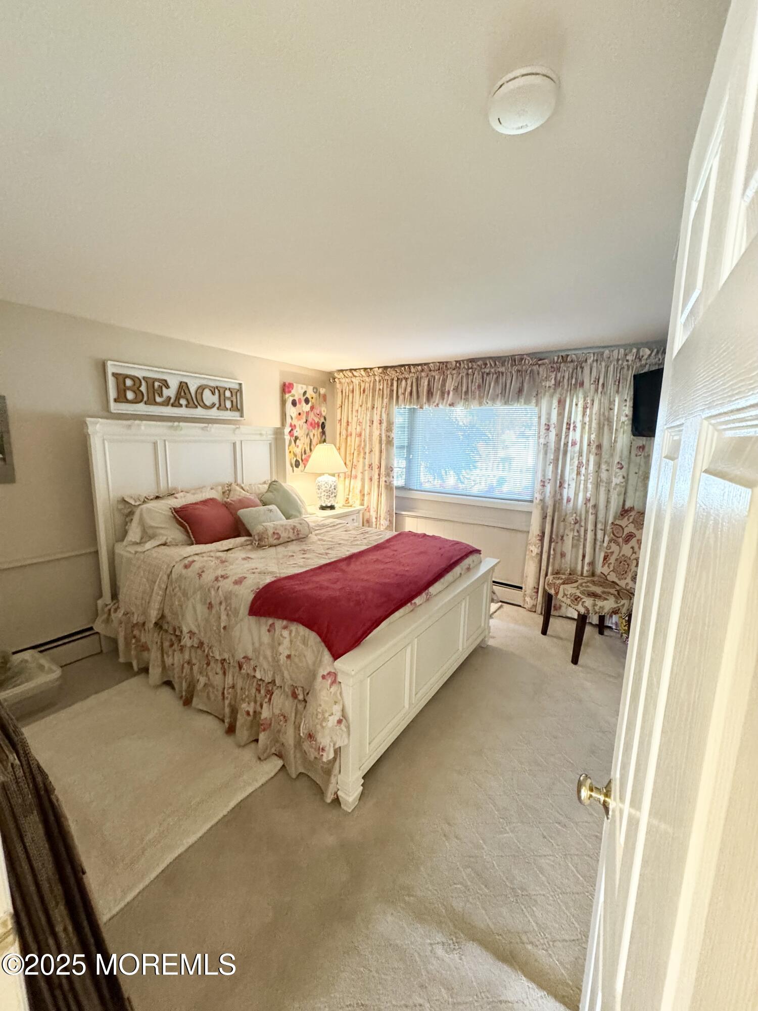 902 10th Street Union Beach, NJ 07735 - Photo 17 of 37 a bedroom with a bed and large window