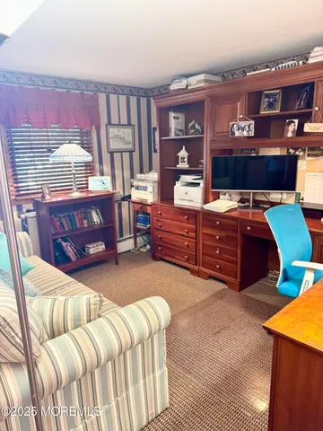 a bed room with a bed and a television