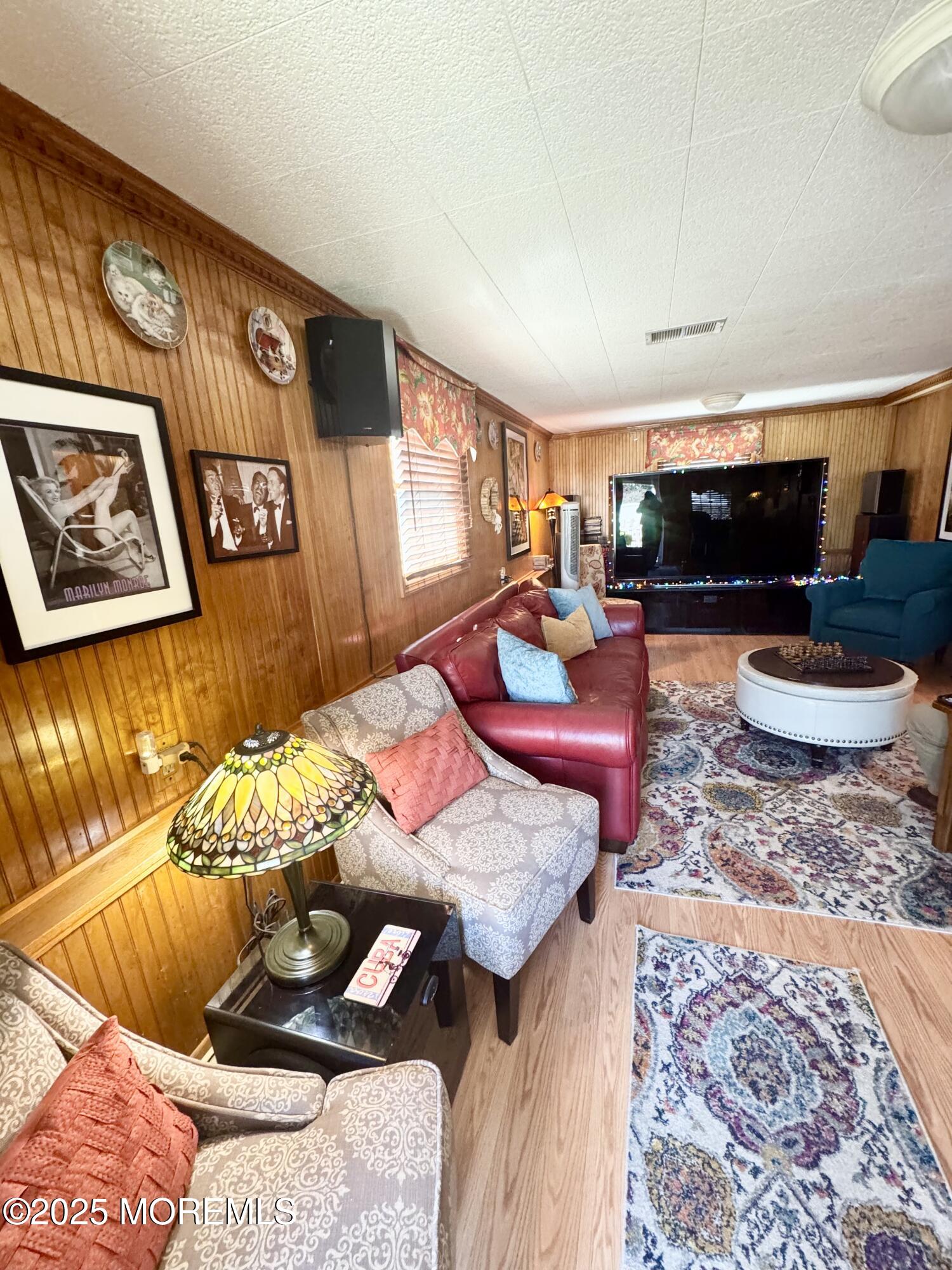 902 10th Street Union Beach, NJ 07735 - Photo 21 of 37 a living room with furniture and a flat screen tv