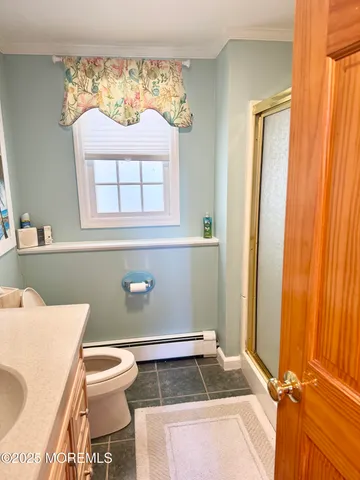 a bathroom with a toilet and a sink