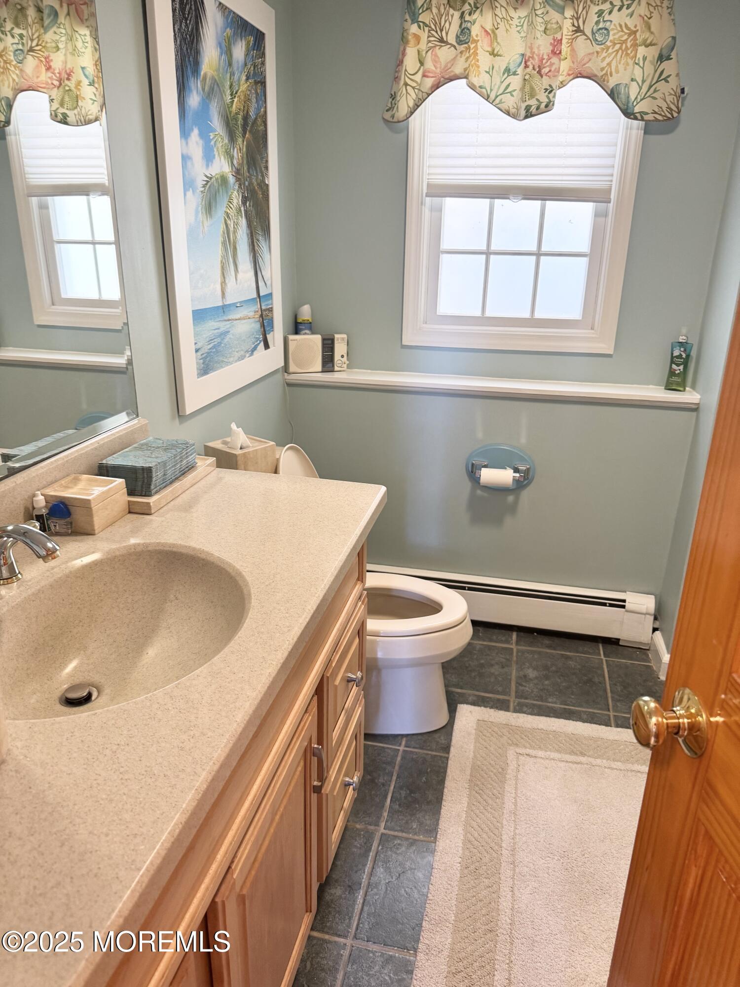 902 10th Street Union Beach, NJ 07735 - Photo 29 of 37 a bathroom with a sink and a toilet