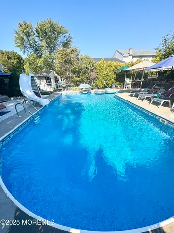 a view of outdoor space with swimming pool and patio