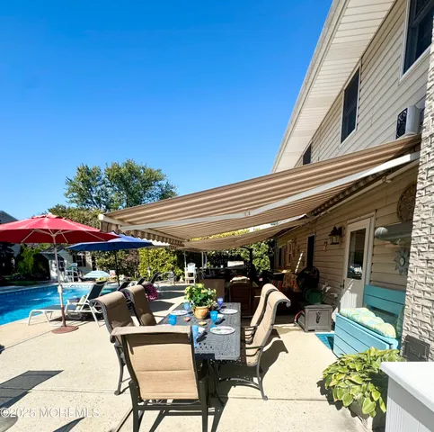 a view of a swimming pool and lounge chairs