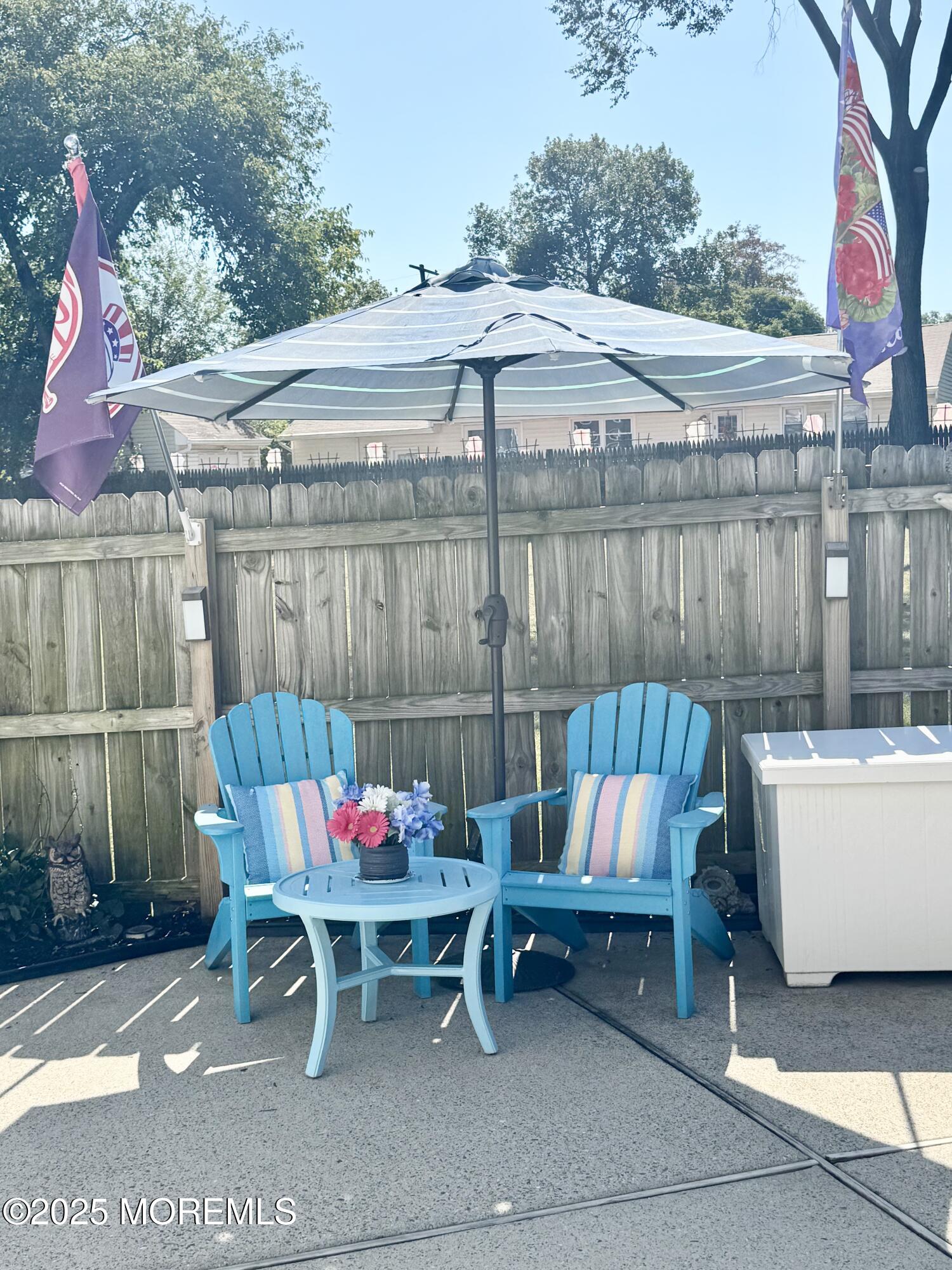 902 10th Street Union Beach, NJ 07735 - Photo 37 of 37 a patio with a table and chairs