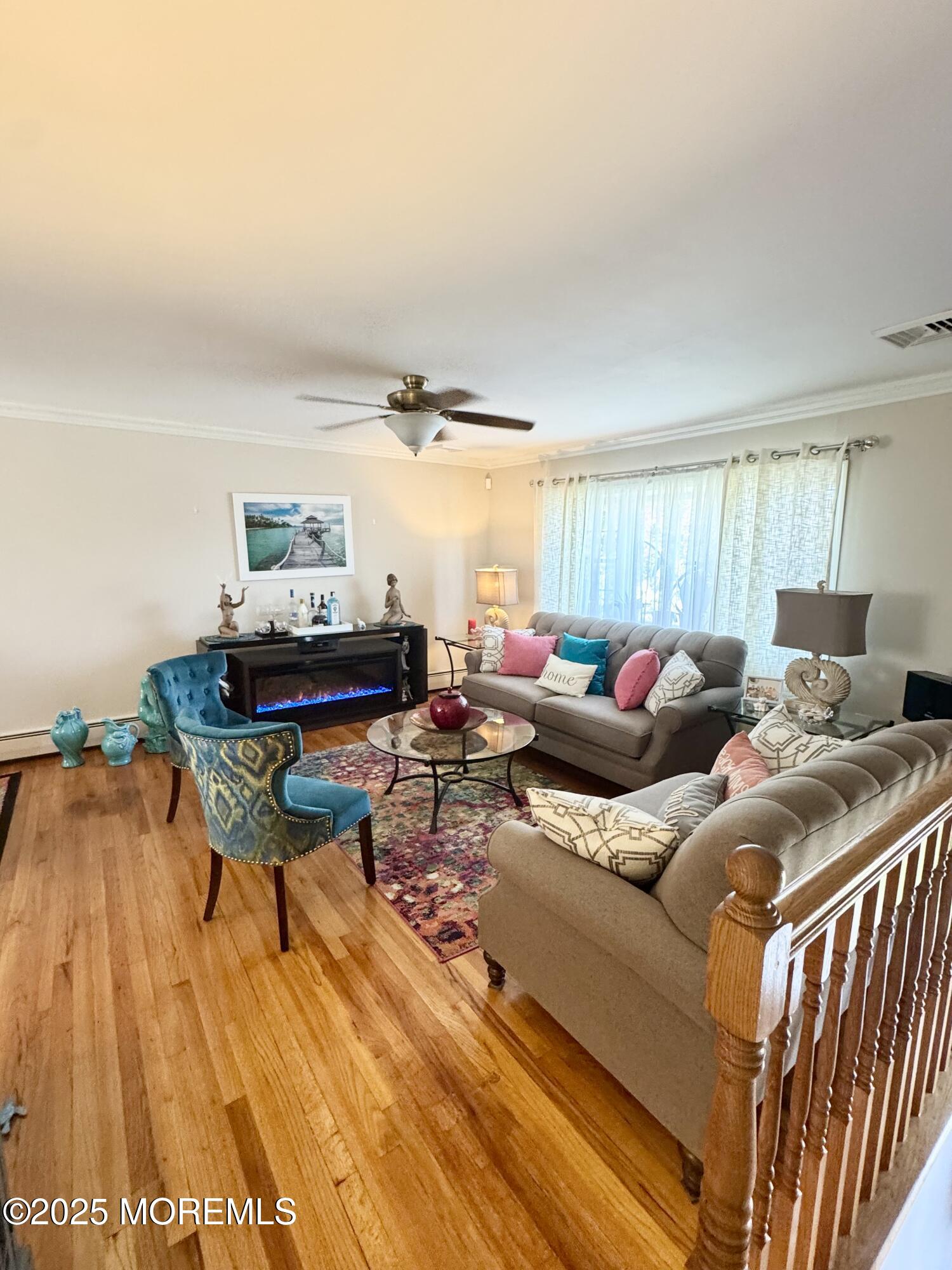 902 10th Street Union Beach, NJ 07735 - Photo 4 of 37 a living room with furniture and a wooden floor