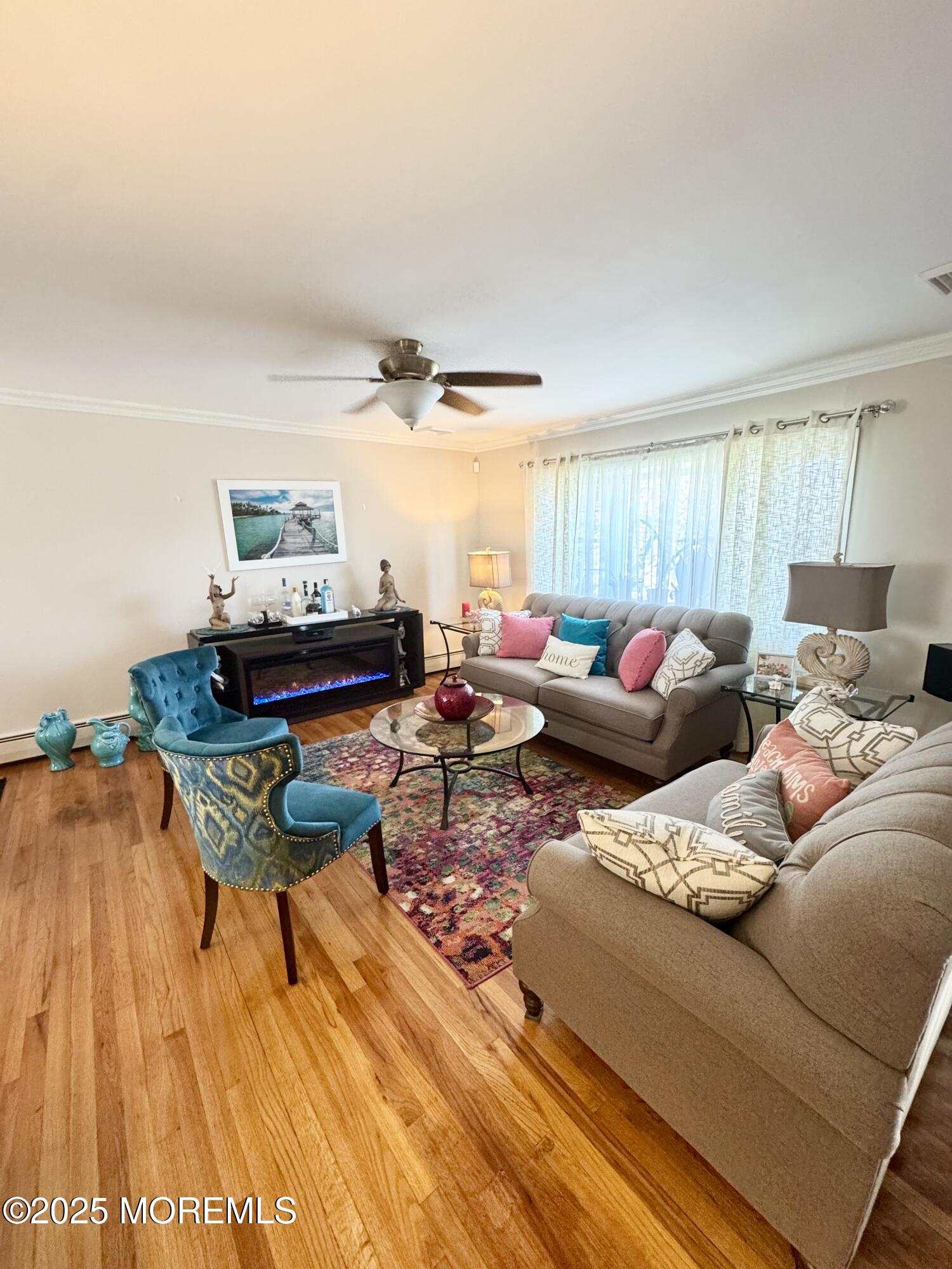 902 10th Street Union Beach, NJ 07735 - Photo 6 of 37 a living room with furniture and a wooden floor