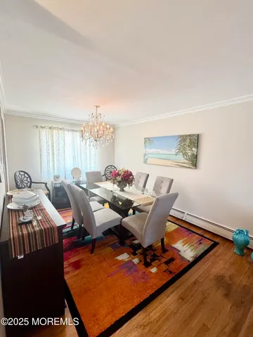 a living room with furniture rug and wooden floor