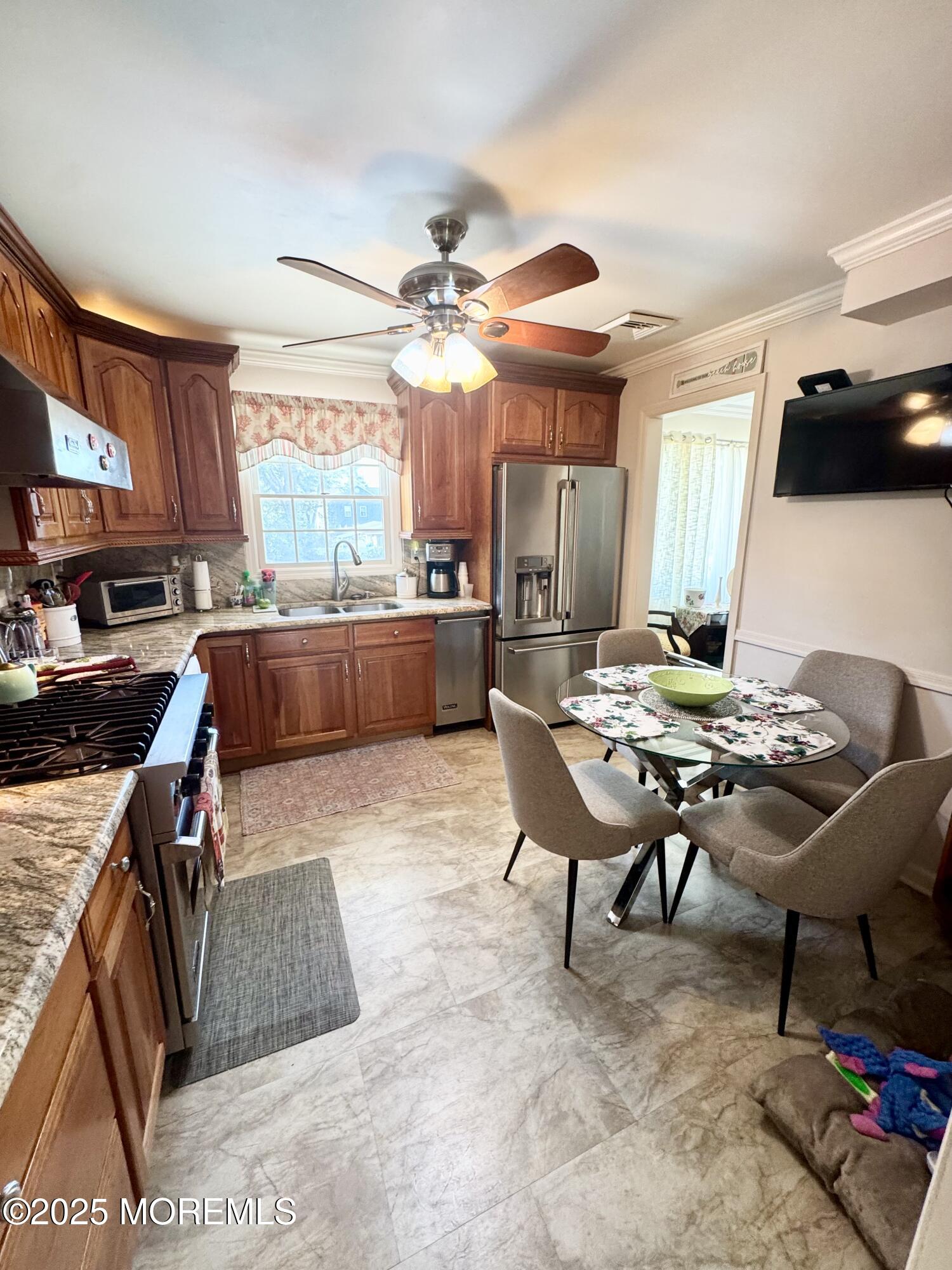902 10th Street Union Beach, NJ 07735 - Photo 8 of 37 a living room with stainless steel appliances kitchen island granite countertop furniture and a large window