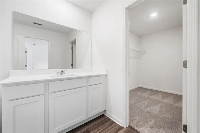 a bathroom with a sink a toilet a tub and shower