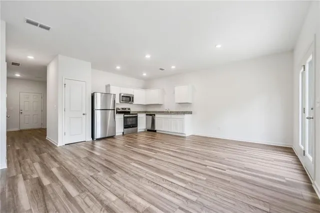 a view of kitchen with wooden floor
