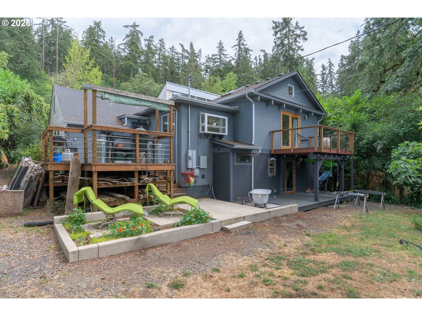 2011 Elk Avenue Eugene, OR 97403 - Photo 2 of 2 a backyard of a house with seating space