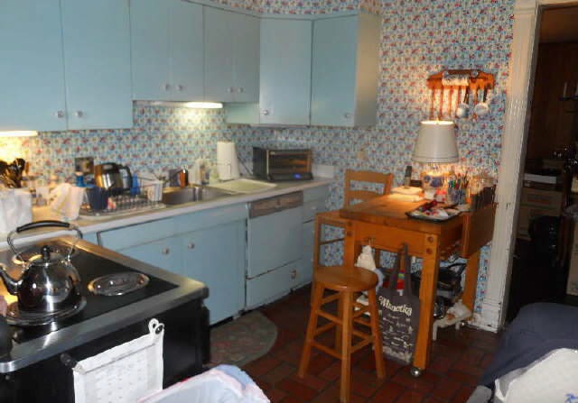 87 Locust Road Winnetka, IL 60093 - Photo 5 of 11 a kitchen with a sink stove and cabinets
