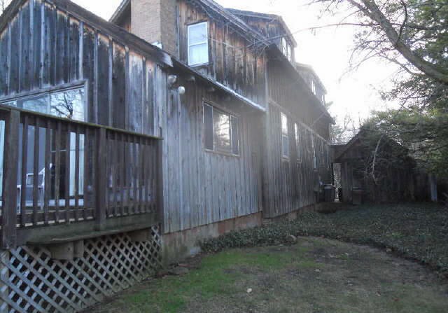 87 Locust Road Winnetka, IL 60093 - Photo 8 of 11 a view of a house with a wooden fence