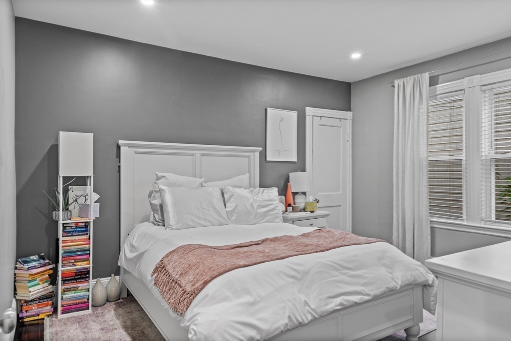 123 King Street, Unit 1 Boston, MA 02122 - Photo 11 of 24 a bedroom with a bed and a closet
