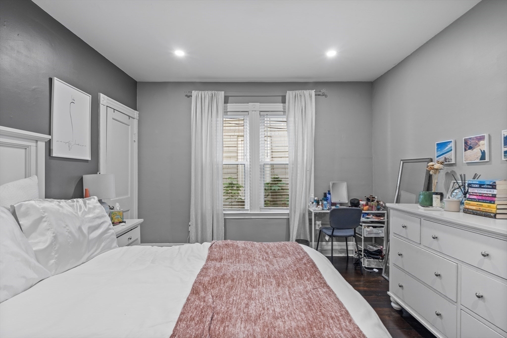 123 King Street, Unit 1 Boston, MA 02122 - Photo 12 of 24 a bedroom with a bed and furniture