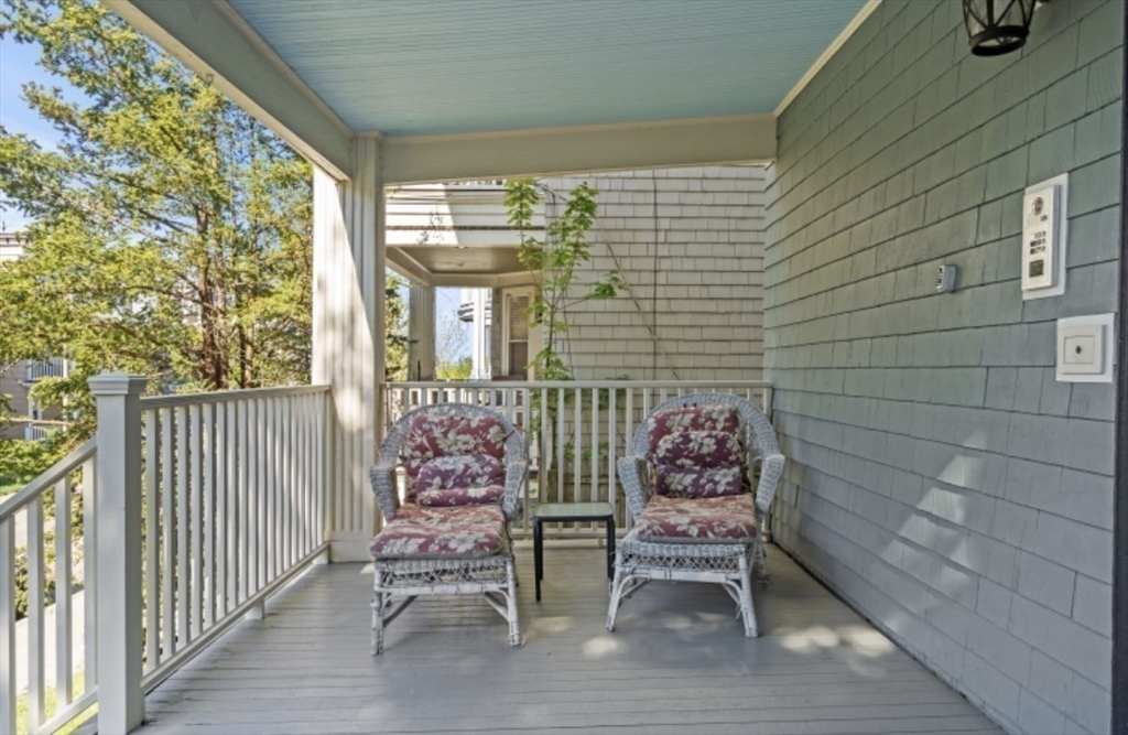 123 King Street, Unit 1 Boston, MA 02122 - Photo 14 of 24 a balcony with table and chairs