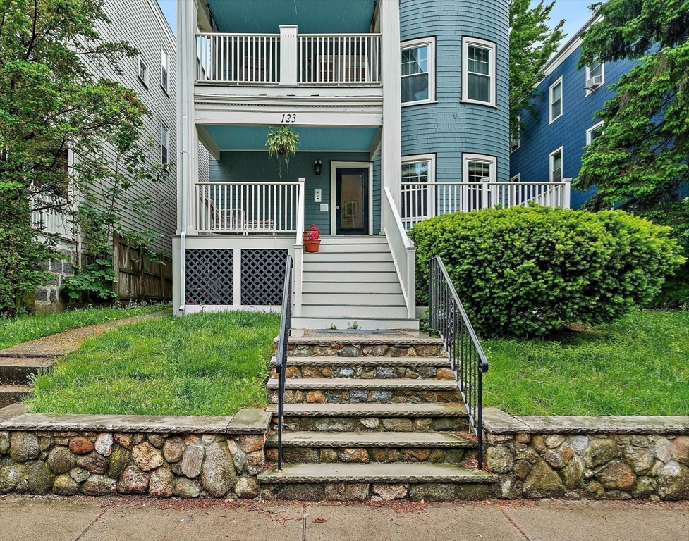 123 King Street, Unit 1 Boston, MA 02122 - Photo 15 of 24 a front view of a house with a garden