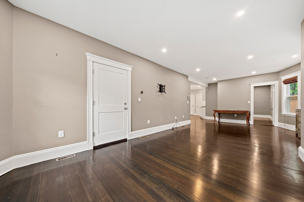 123 King Street, Unit 1 Boston, MA 02122 - Photo 9 of 24 a view of empty room with wooden floor