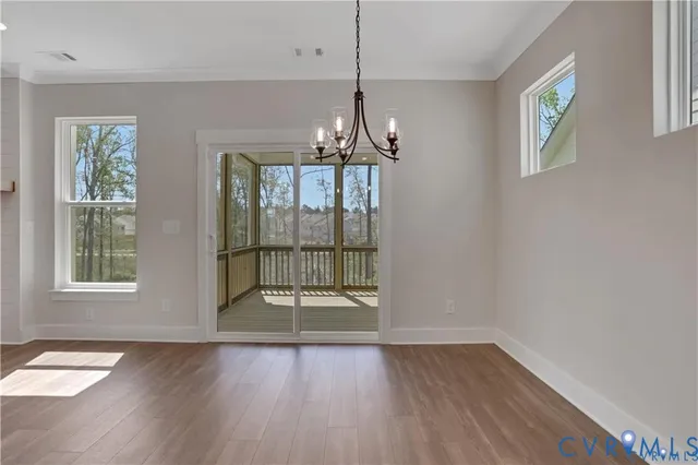 an empty room with closet and ceiling fan