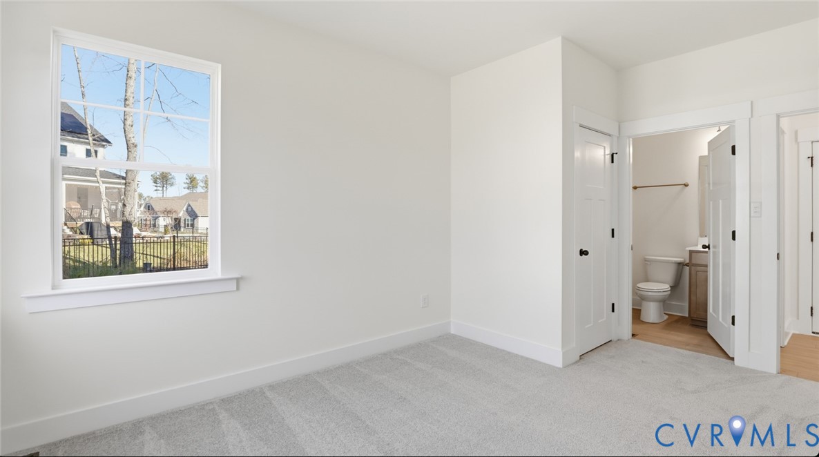 8900 Freebridge Road Chesterfield, VA 23832 - Photo 16 of 50 an empty room with a window and a bathroom