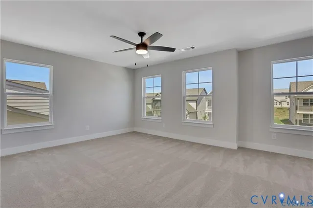 a spacious bathroom with a double vanity sink a mirror and a shower