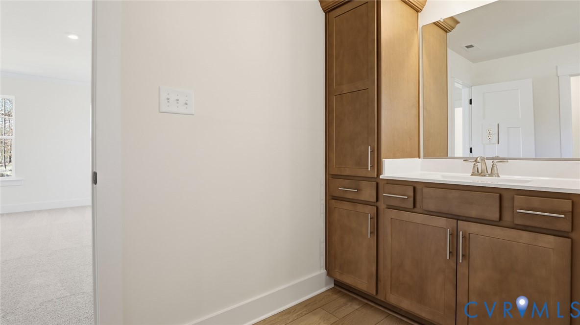 8900 Freebridge Road Chesterfield, VA 23832 - Photo 27 of 50 a bathroom with a sink and a mirror